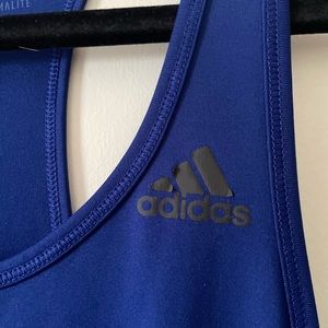 Both adidas tanks slightly worn